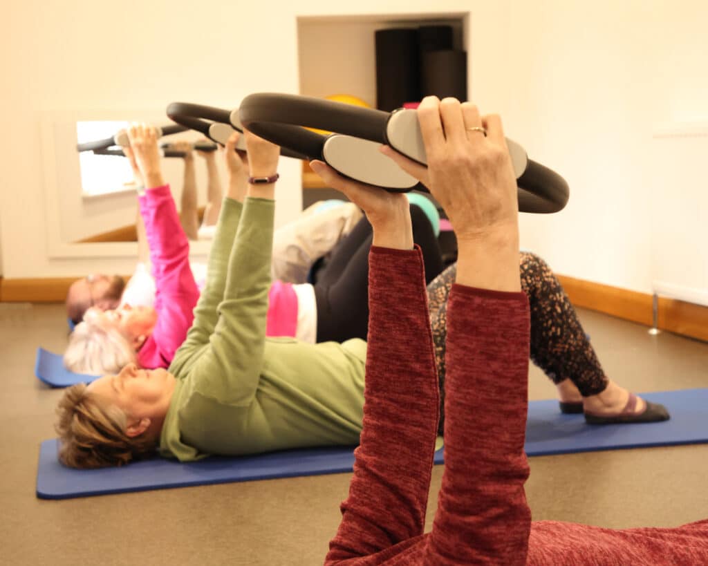 Pilates class using additional equipment